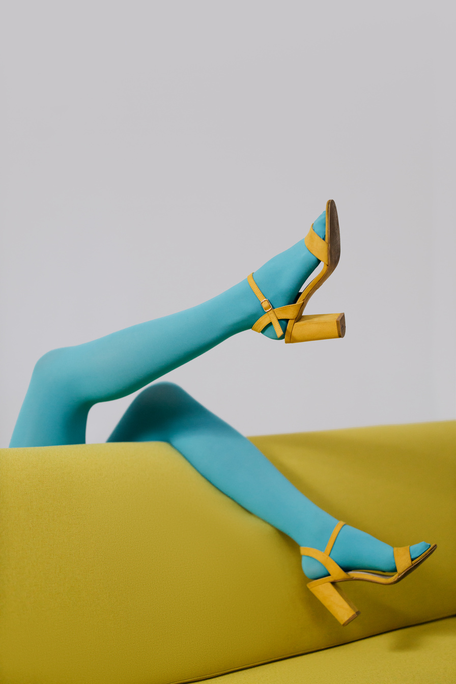 A Person in Blue Stockings and Yellow Shoes